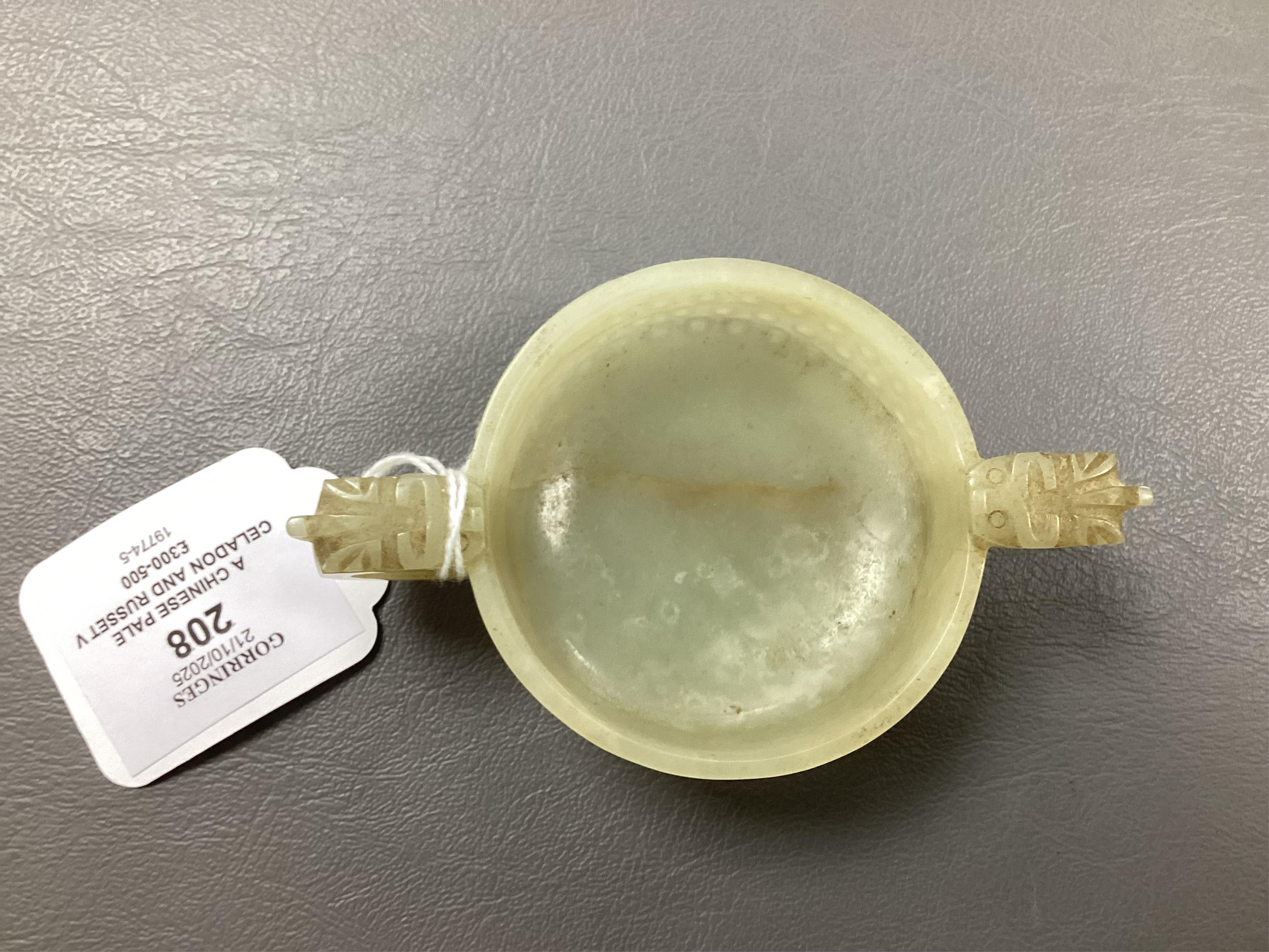 A Chinese pale celadon and russet veined jade cup, 17th century